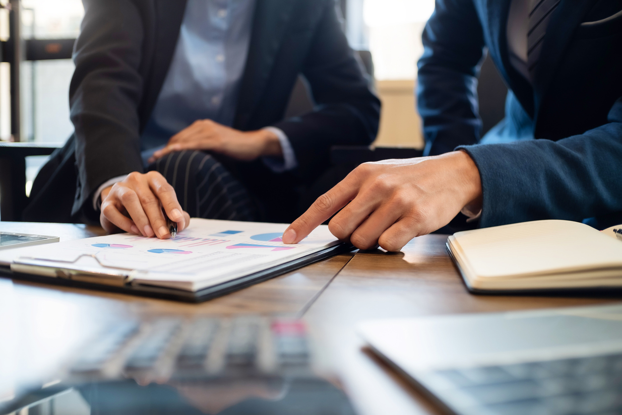 Investor calculating profits on stock market exchange.